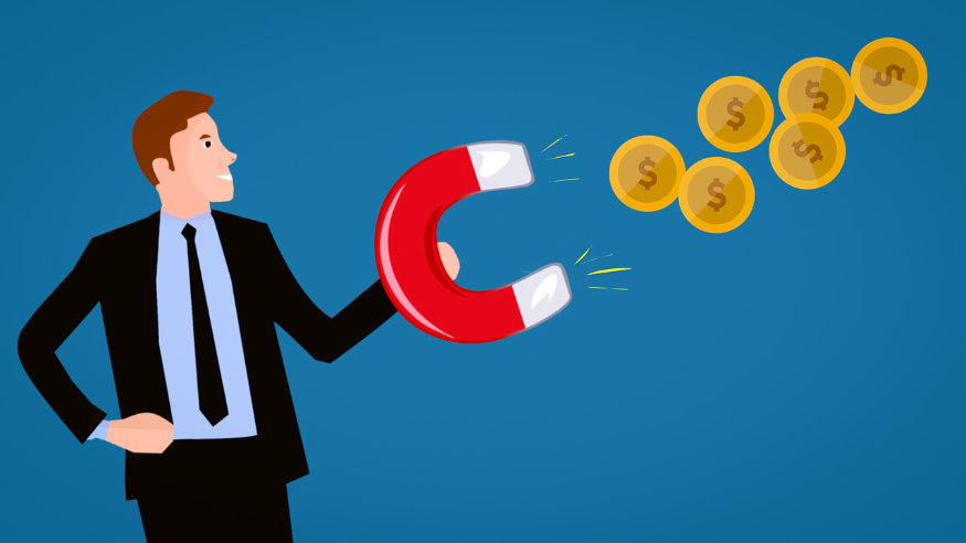 człowiek z magnesem przyciągającym monety